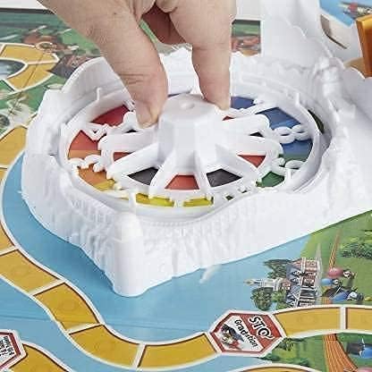 The Game of Life Game, Family Board Game for 2 to 4 Players, for Kids Ages 8 and Up, Includes Colorful Pegs, Multicolour