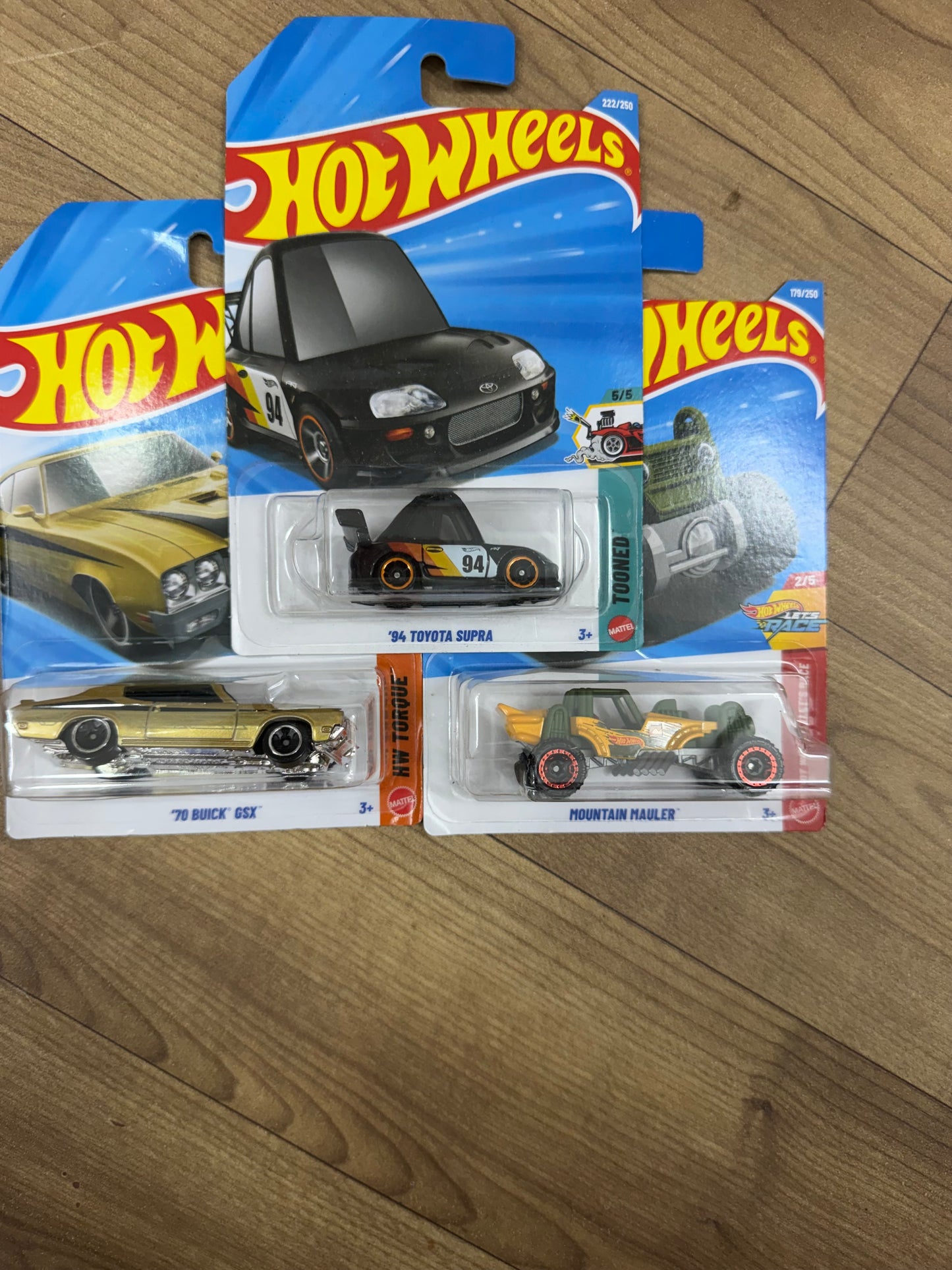SINGLE HOTWHEELS CAR- 94 TOYOTA SUPRA AND MOUNT HAULER AND 70 BUICK GSX