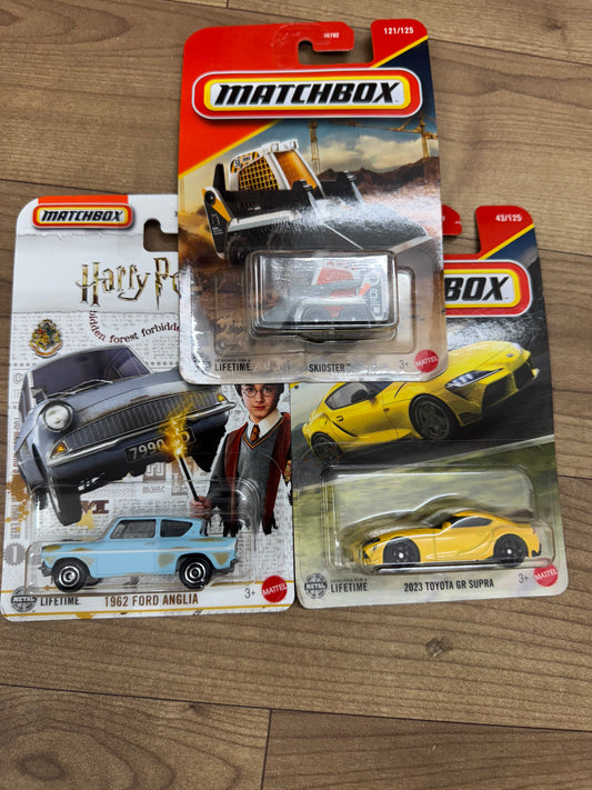 MATCHBOX 1962 FORD ANGLIA- HARRY POTTER AND MATCHBOX TOYOTA GR SUPRA 2023 AND MATCHBOX SKIDSTER