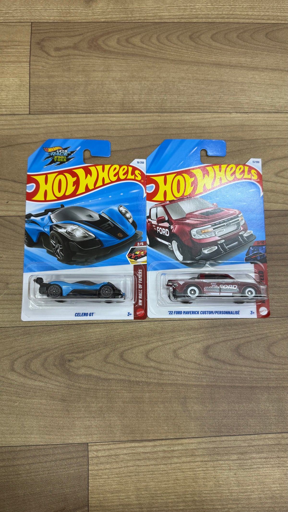 CELERO GT- A CASE OF 2027 SINGLE HOTWHEELS CAR AND 22 FORD MAVERICK CUSTOM/ PERSONNALISE- A CASE OF 2027 SINGLE HOTWHEELS CAR