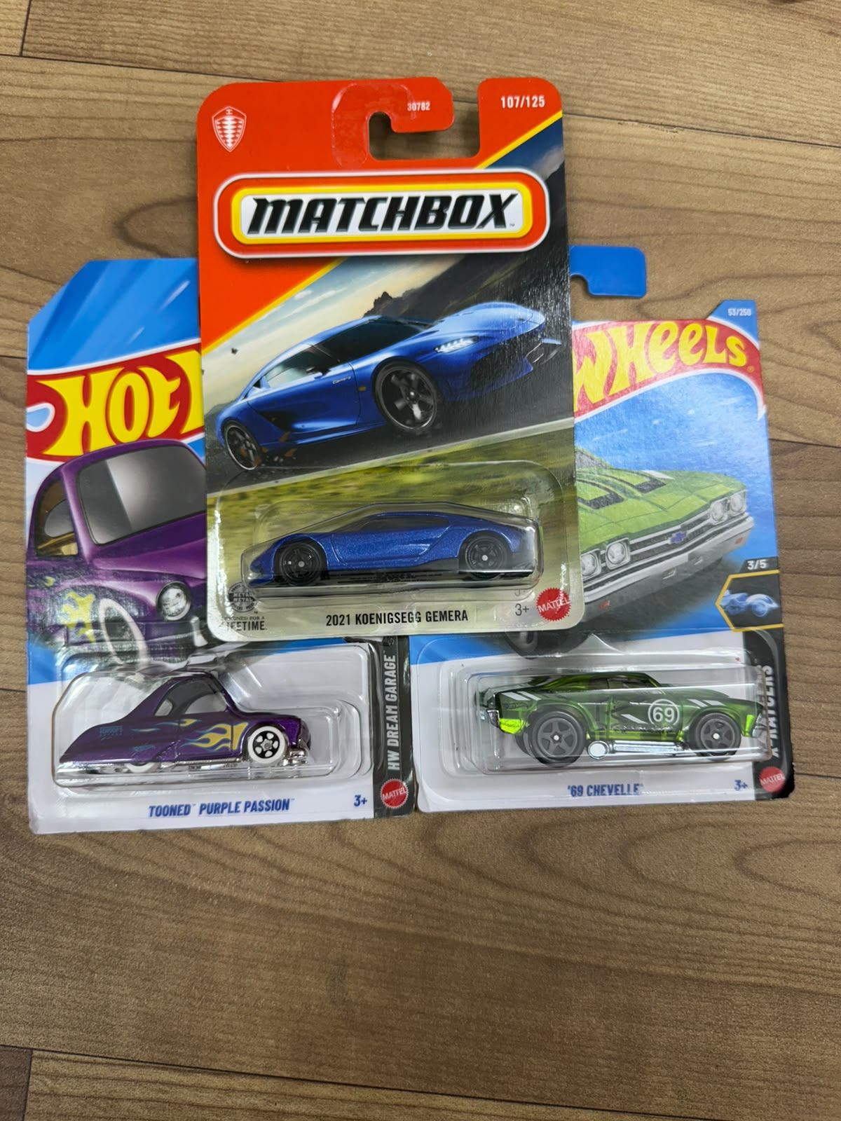 2021 KOENIGSEGG GEMERA (MATCHBOX CAR- 30782) AND TONNED PURPLE PASSION (SINGLE HOTWHEELS CAR) AND 69 CHEVELLE (SINGLE HOTWHEELS CAR)