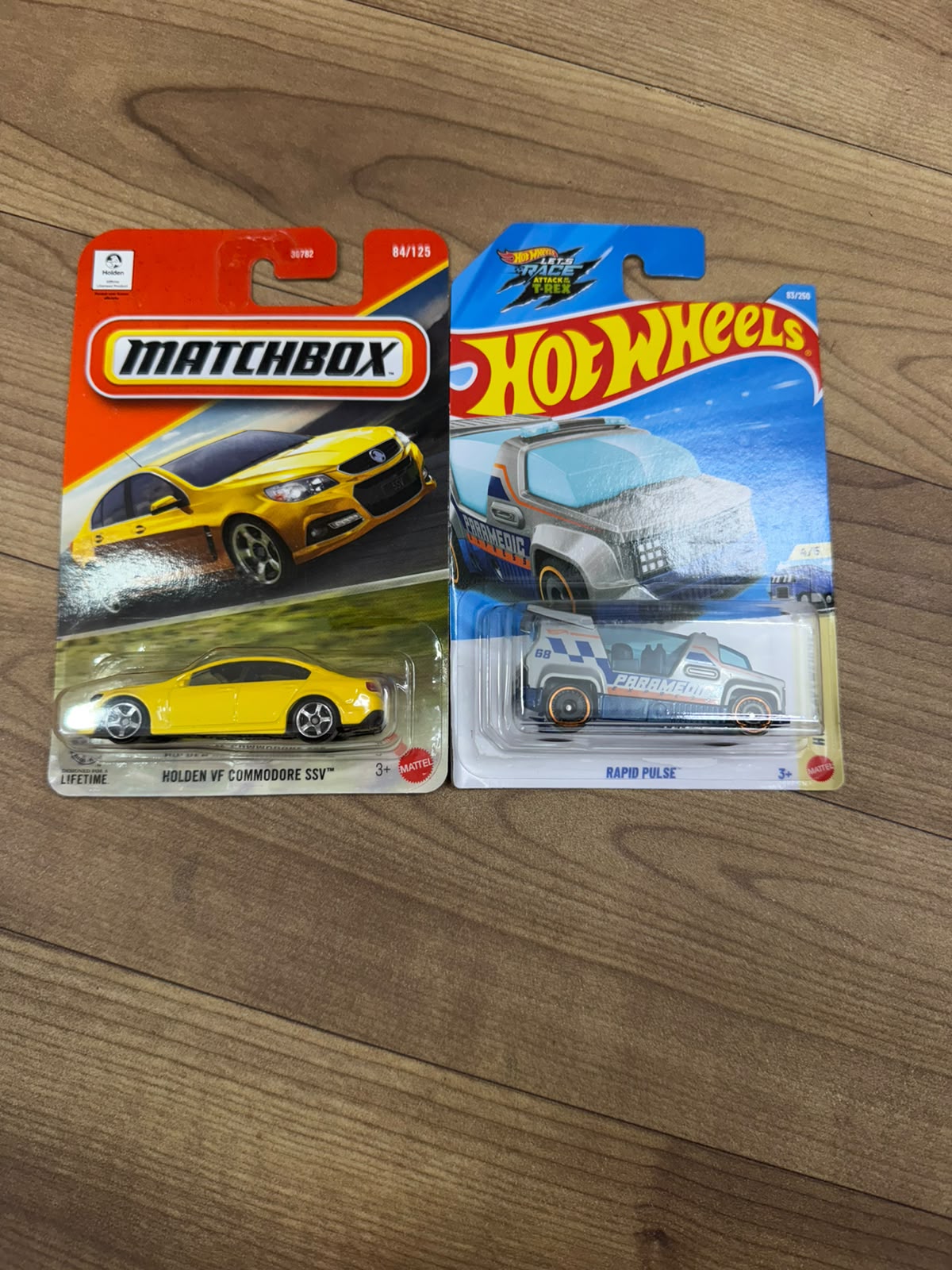 HOLDEN VF COMMODORE SSV (MATCHBOX CAR- 30782) AND RAPID PULSE (SINGLE HOTWHEELS CAR)