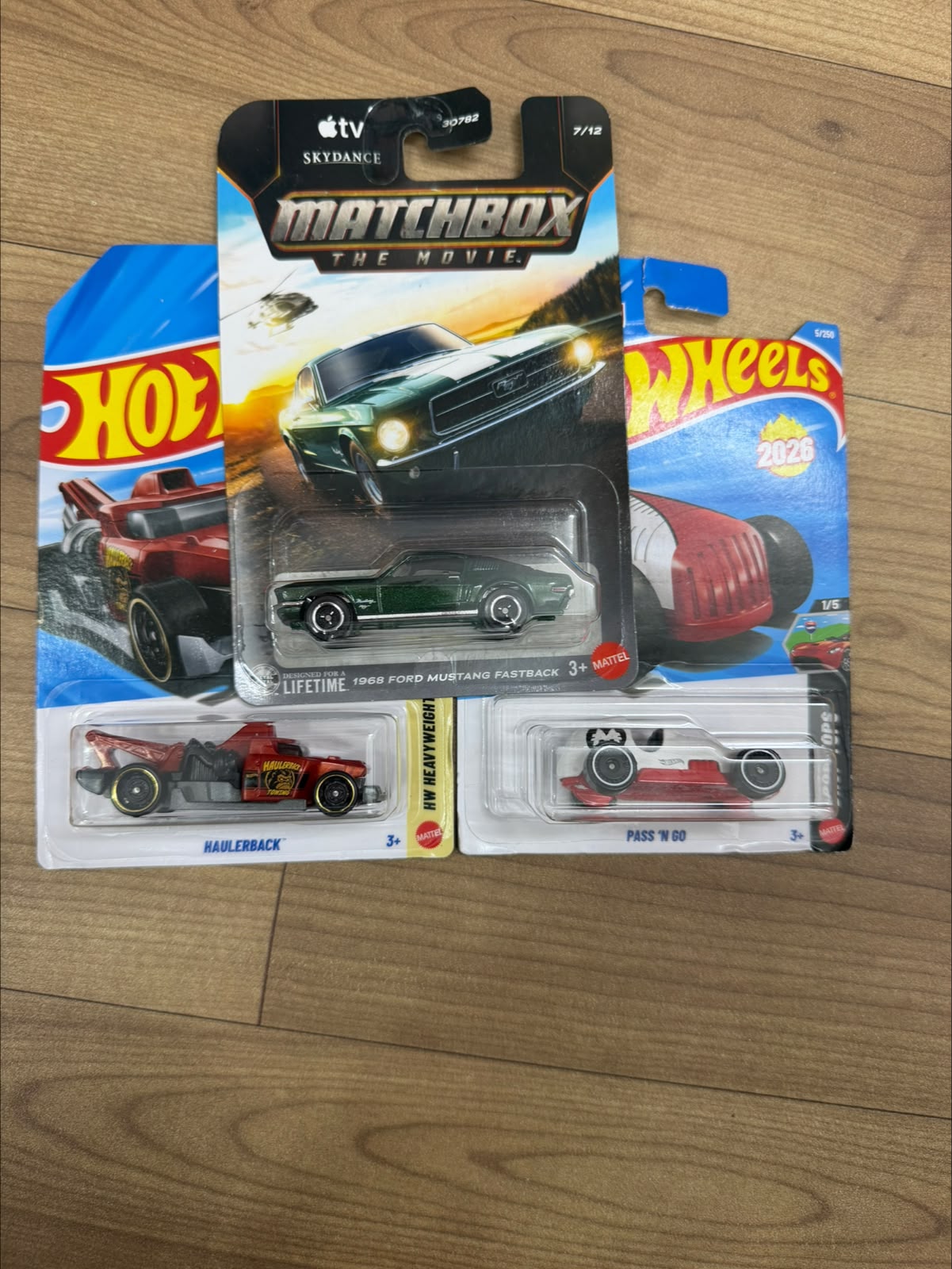 1968 FORD MUSTANG FASTBACK (MATCHBOX CAR- 30782) AND PASS N GO WHITE (SINGLE HOTWHEELS CAR) AND HAULER BACK (SINGLE HOTWHEELS CAR)