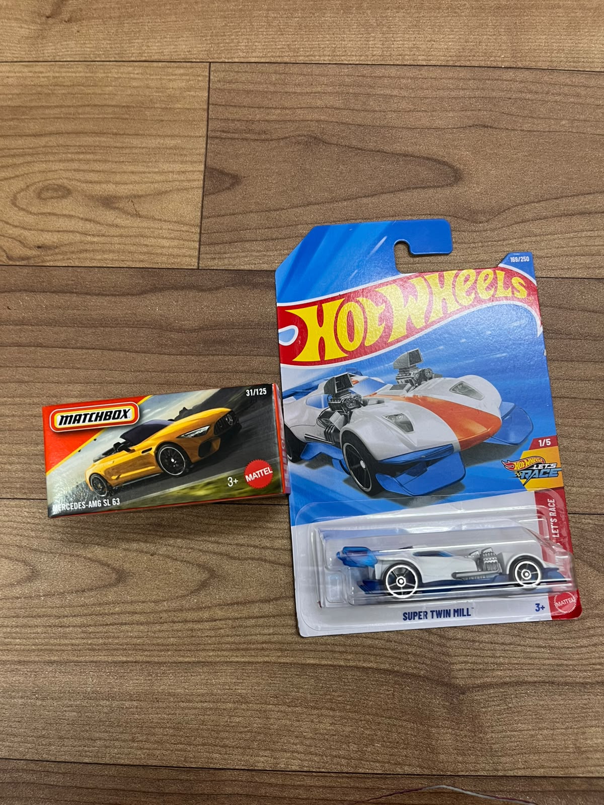 MERCEDES AMG SL 63(MATCHBOX CAR) AND SUPER TWIN MILL HOTWHEELS SINGLE CAR